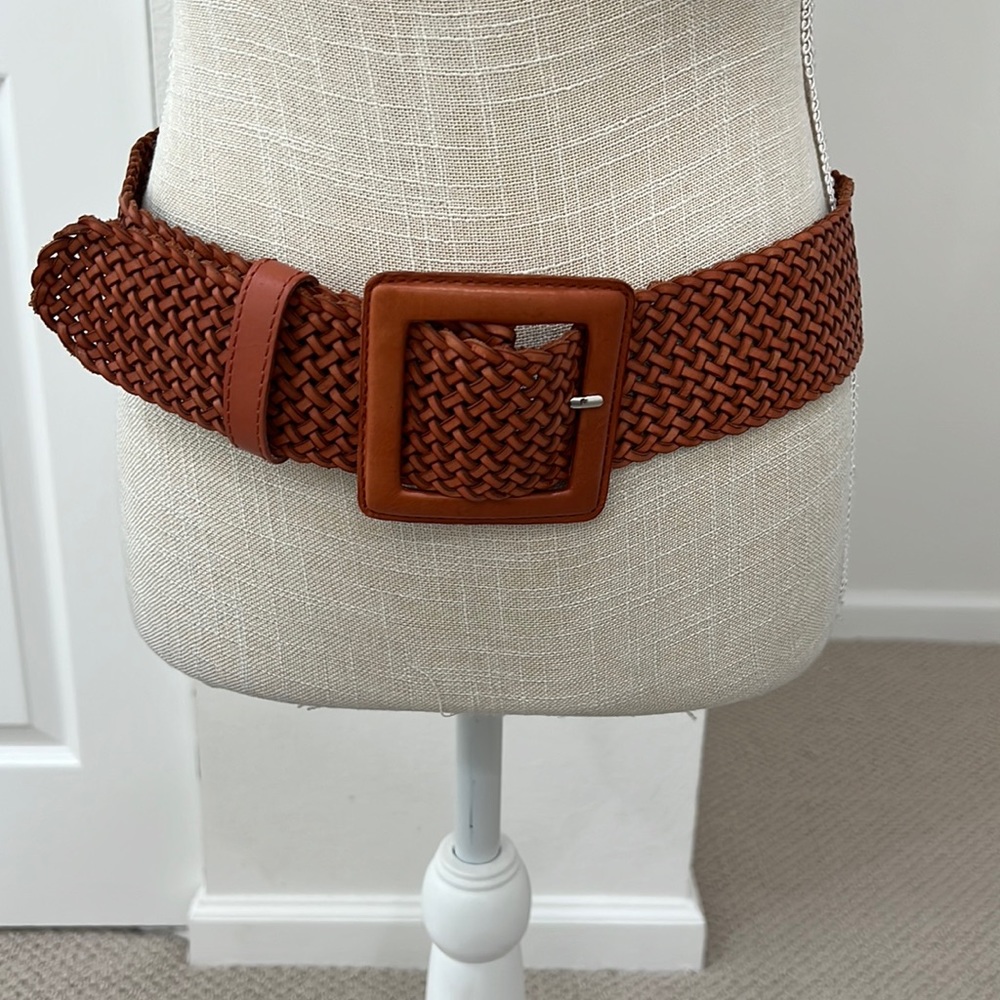 Never worn all leather warm brown belt with woven design.